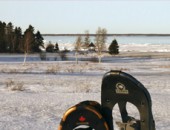 Snowshoes in front of seaside trail