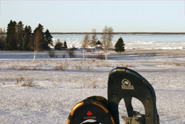 Snowshoes in front of seaside trail